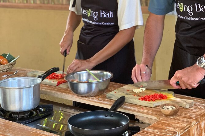 Authentic Balinese Cooking Class in Ubud - Grinding spices the Balinese way
