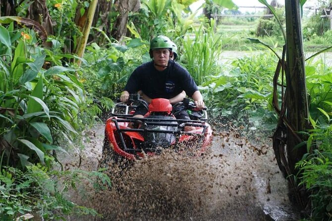 Bali ATV Quadbike Through Gorilla Face Cave - River crossings, mud, and steep climbs