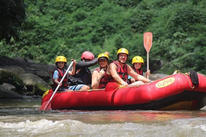 Bali ATV Rafting And Ubud Waterfall Private Tour - ATV riding through mud, forest, and rice fields