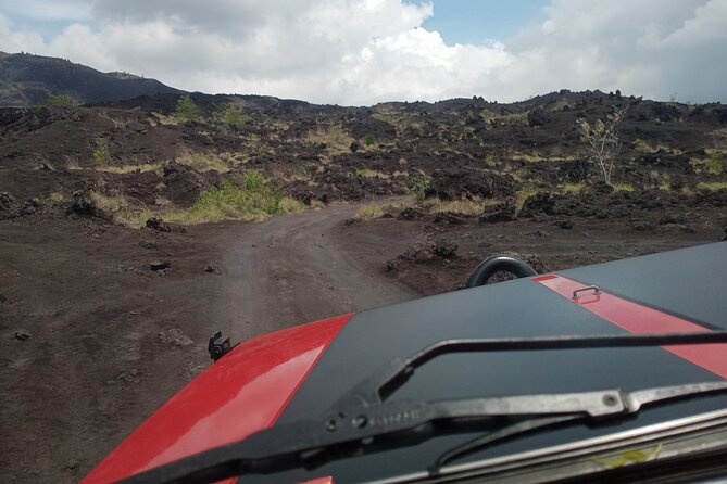 Batur Volcano Sunrise And Black Lava Jeep Adventure Tour - Black lava and sandy volcanic ground