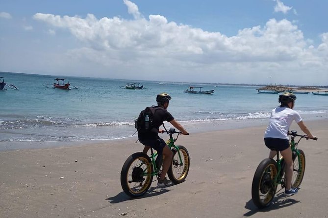 Kuta Beach eBike Private Tour - Entering Kuta’s royal sea temple