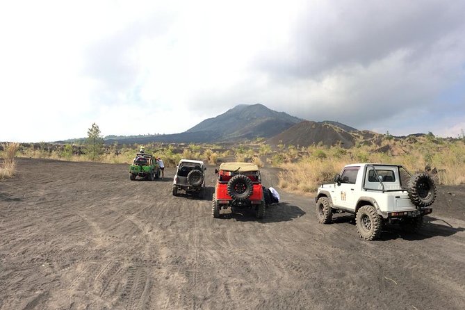 Mount Batur Jeep Sunrise & Overnight Glamping Experience - Black lava and sand fields after sunrise