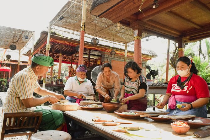 Rural Charm of Bali Tour - Grinding spices in a traditional kitchen